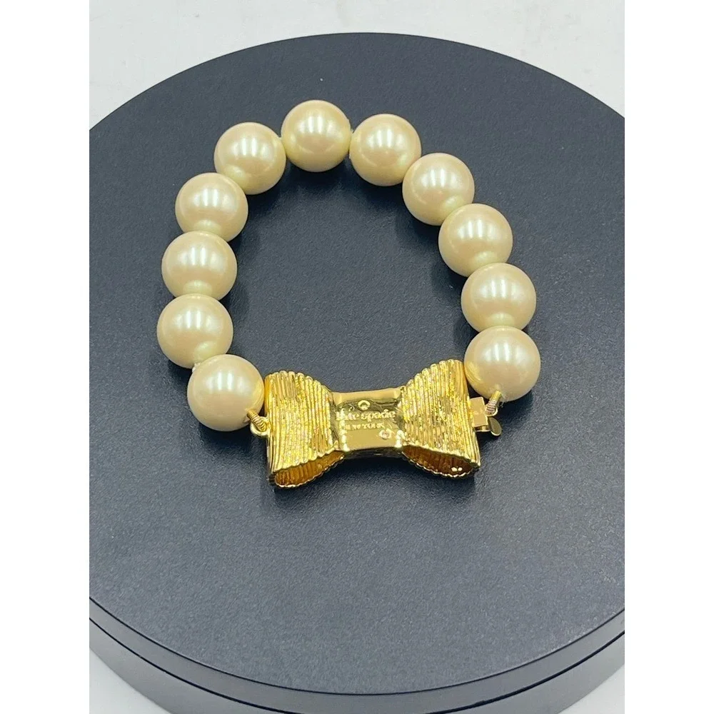 Kate Spade All Wrapped Up Pearl Gold Bow Bracelet‎